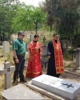 Father Alexander (Zarkashev), current priest of the Russian Orthodox Church of St Nicholas conducting prayers in the Russian section of the Doulab Christian Cemetery in Tehran in 2019 (M. James Personal Collection).